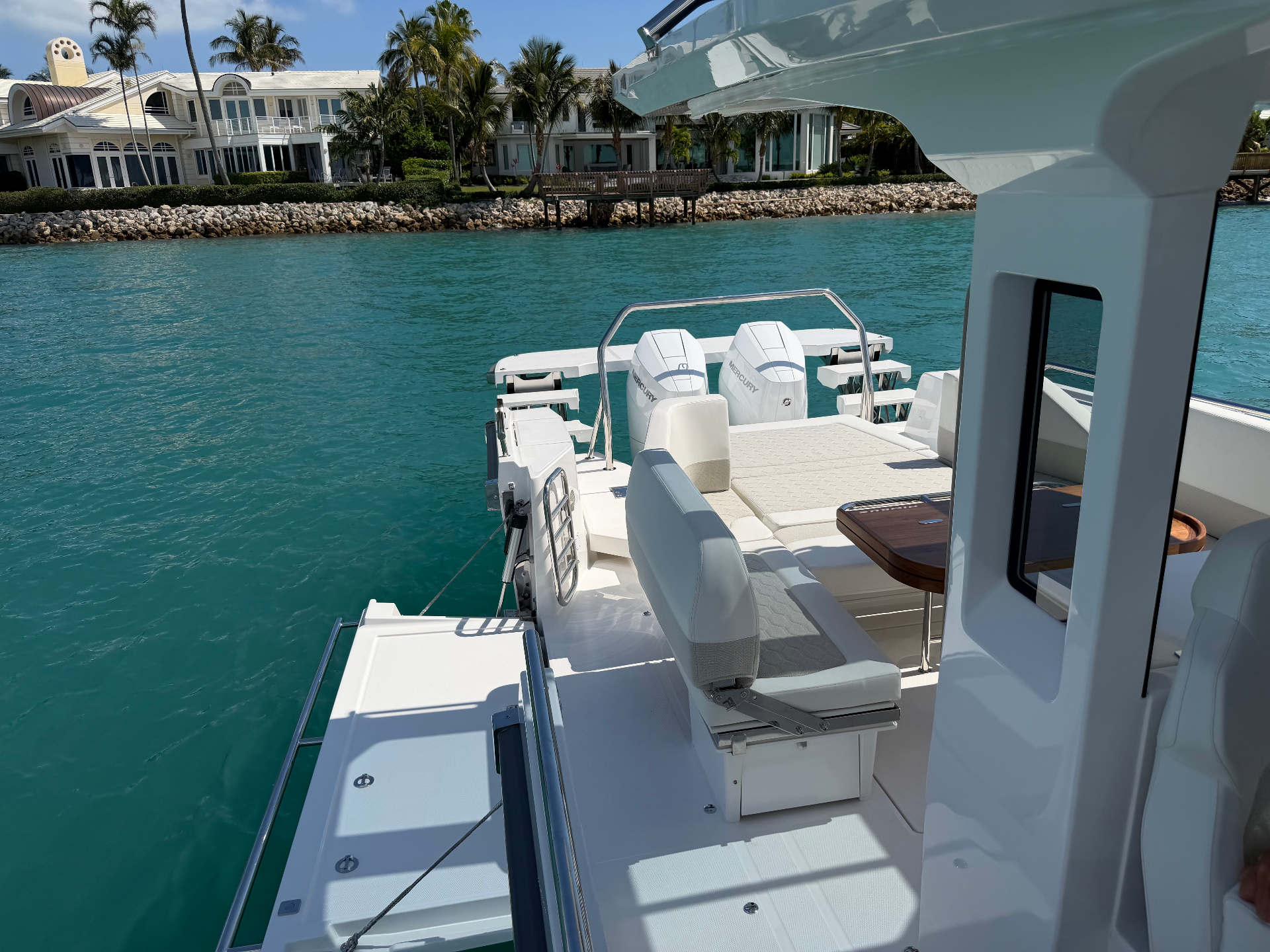 The hydraulic swim platform deployed and the side dive door open — the T12's most meaningful real-world upgrade for time spent at anchor.